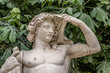 Beautiful antique, historical statue in the free public park, the Tuileries Gardens, in Paris, France.