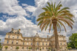 In Paris, France, a beautiful palm tree in front of the historical palace at the free public park, the Luxembourg Gardens.