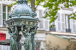 A historic water fountain in Montmartre, in Paris, France.