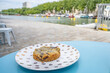A yummy chocolate cookie treat at a cafe on the Canal Saint Martin in Paris, France. Shallow focus on the close side of the cookie for artistic effect