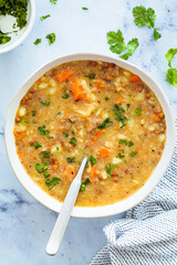 Wall Mural - Vegan soup with potatoes, sweet potato and lentils in white bowl. Plant-based recipe.