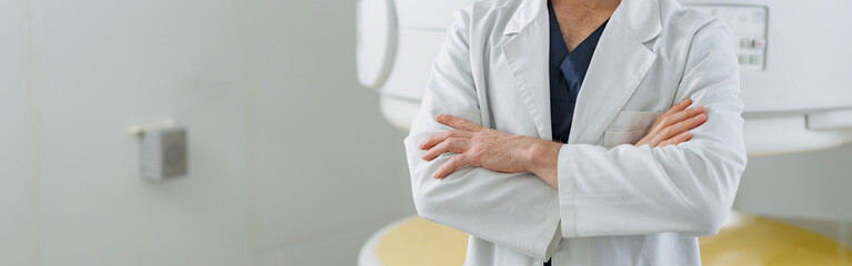 Wall Mural - Radiologist on background of MRI or CT or PET Scan with female patient undergoing procedure