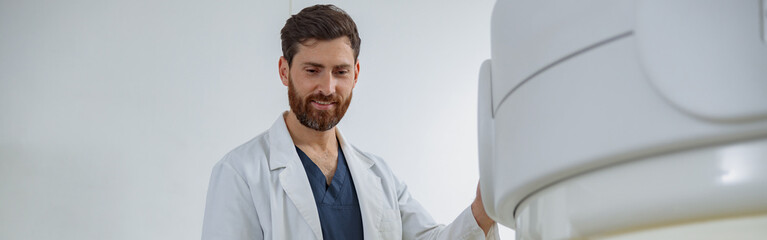 Wall Mural - Radiologist controls MRI or CT or PET Scan with female patient undergoing procedure