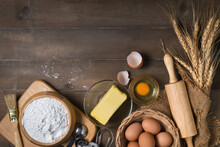 Bread Flour With Fresh Egg, Unsalted Butter And Accessories Bakery On Wood Background,
