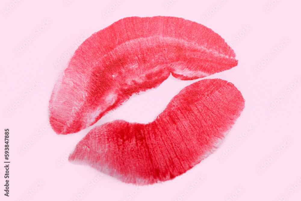 Red lipstick kiss mark on lilac background