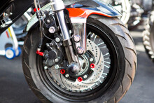 Motorcycle Wheels With Car Accessories In Showroom