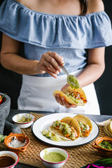 Sticker - Mexican woman hands preparing tacos al pastor and eating traditional mexican food in Mexico Latin America, hispanic people