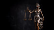 Law and Justice concept image. Themis, symbol of law on dark background.