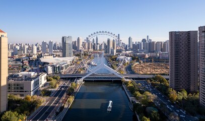 Sticker - Aerial shot of the Tianjin Eye over the lake amid the skyscrapers, China