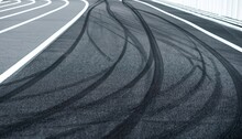Abstract Texture Surface And Background Of Car Tire Drift Skid Mark On Road Race Track, Black Tire Mark On Street Race Track, Automobile And Automotive Concept