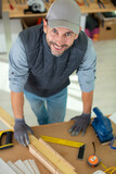 Fototapeta  - image of mature carpenter in the workshop