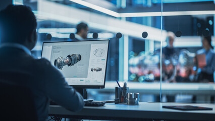 Fototapete - Industrial Engineer Working on CAD Software on Desktop Computer in Turbine Engine Startup Facility. Specialists and Professionals Researching and Developing High Tech Engine Technology.