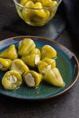 Wall Mural - Peppers stuffed with cream cheese on plate.