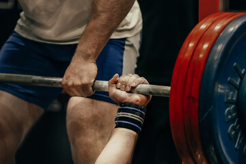 Wall Mural - hand male powerlifter hold barbell bar before bench press powerlifting competition, power sports games