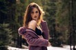 © Ionut Dragoi/Wirestock Creators - Confident pretty woman wearing a top with a coat in the snowy forest