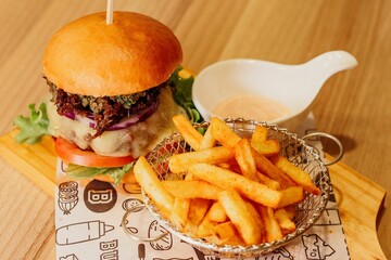 Sticker - Scrumptious closeup of a hamburger and fries meal, prepared with fresh ingredients