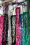 Fototapeta  - Weaving macrame from cotton thread. Colored items on display.