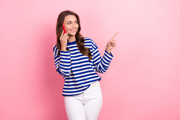 Canvas Print - Photo of nice woman wavy hairdo wear striped shirt talking on cellphone look empty space delivery order isolated on pink color background