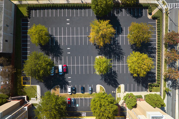 Wall Mural - Aerial view of many colorful cars parked on parking lot on apartment building backyard. Place for vehicles in front of residential condo