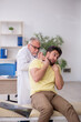 © Elnur - Young male patient visiting old male doctor
