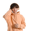 © Pixel-Shot - Teenage boy with headphones listening to music on white background