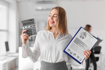 Canvas Print - Female accountant with calculator and document in office