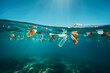 © MVProductions - Plastic bottles and other waste floating in ocean, high quality generative ai