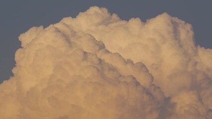Wall Mural - Cloud closeup Time lapse video. Large, detailed clouds captured from a distance with high-quality cameras and lenses.