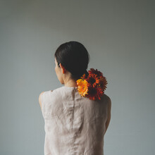 Back Of Woman With Flowers