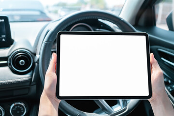 Wall Mural - Woman sitting in a private car and hand holding digital tablet mockup of blank screen, Take your screen to put on advertising.