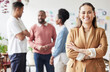 © JLJ/peopleimages.com - Business woman, portrait and leadership with smile in startup office or happy for career by team. Female manager, excited face or success with teamwork, arms crossed or happiness for entrepreneurship