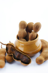 Wall Mural - fresh Delicious ripe tamarinds, tamarind with brown pulp with green leaf.