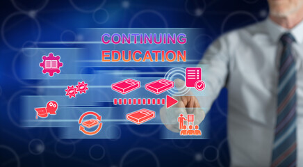 Wall Mural - Man touching a continuing education concept