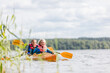 © Photocreo Bednarek - Happy senior active couple kayaking on lake