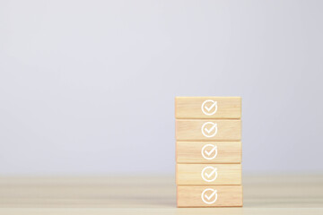 Elections and Voting, Vote, to-do list, checklist, Task list, Survey, and assessment concept. Handpick green check mark on a wooden block.	