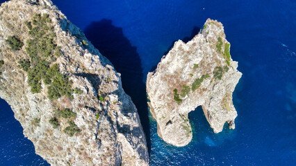 Wall Mural - Amazing aerial view of Faraglioni in summer season. Rock natural formations in Capri Island, Italy