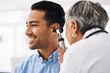 © Sharne T/peopleimages.com - Doctor check patient ear, healthcare and medical consultation at hospital with otolaryngology specialist. Happy man and physician woman with otoscope, test for hearing problem and health insurance