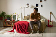 © pressmaster - Thoughtful teenager sitting on bed in his room alone and thinking about something