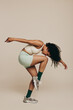 Balance and flexibility: Fit woman performing a workout pose