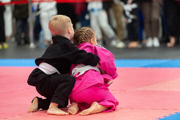 Brazilian jiu jitsufight between boy and girl