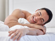 © Jade M/peopleimages.com - In a committed relationship with my bed. a handsome young man lying in bed.