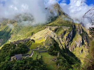 Sticker - Landscape of the stunning mountains of Machu Picchu covered in the fog in Peru