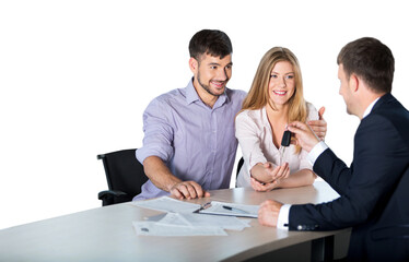 Happy couple with car dealer in auto show or salon