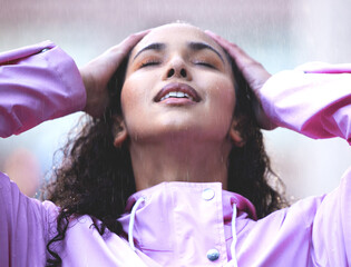 Poster - Sometimes you need the refreshing feeling of rain. a young woman standing in the rain.