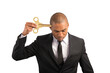© alphaspirit - Weary  businessman recharge himself with a key due to overwork