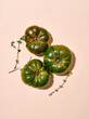 © ADDICTIVE STOCK - Green tomatoes in bright sunlight flat lay with copy space