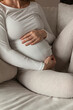© Ulrika Kestere - Pregnant woman holding her belly