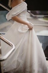 Wall Mural - Shallow focus of a bride in a white wedding dress outdoors