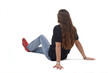 © curto - side and back view of a young girl sitting on the floor  on white background