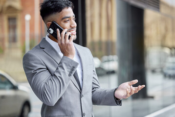 Canvas Print - Ive got the perfect plan for that. a handsome young businessman standing in the city and using his cellphone.